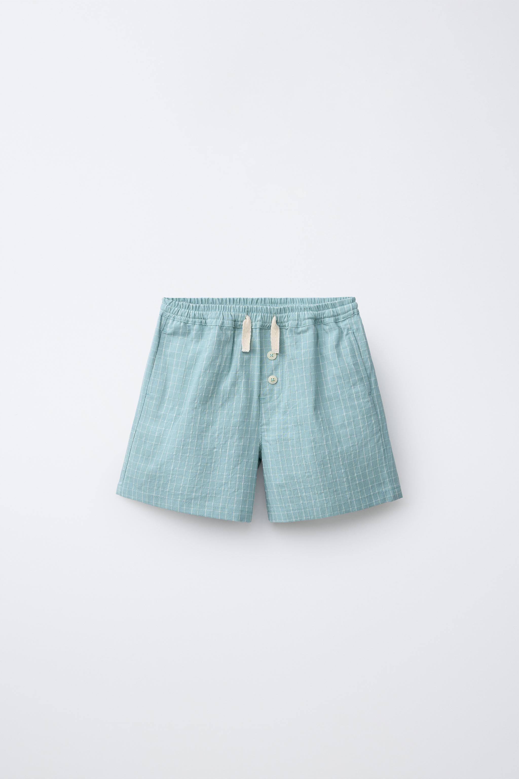 BUTTONED PLAID SHORTS
